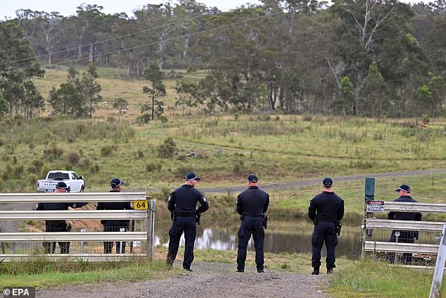 Police are seen conducting a search in Bungonia, in the Southern Tablelands of New South Wales, on Monday.