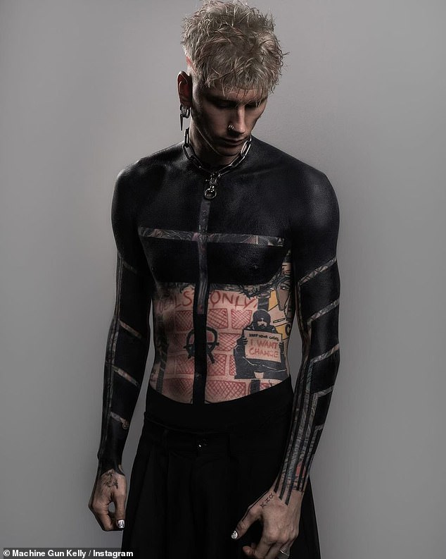 Machine Gun Kelly, 33, surprised fans when he revealed his dramatic opaque tattoo on Instagram