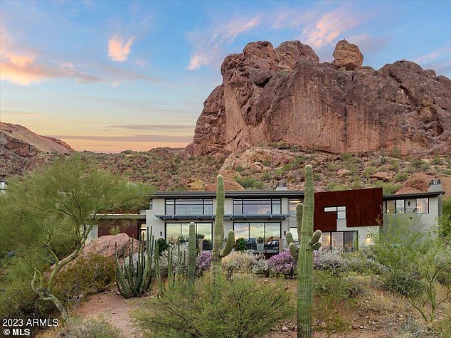 On sale for $8,888,888, this five-bedroom home is nestled among cacti and spectacular rock outcrops, designed to maximize views of the Camelback and Mummy Mountains.