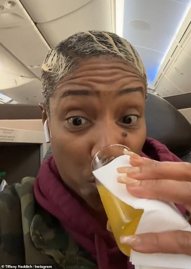 Haddish spoke to her more than 7.4 million Instagram followers while relaxing in business class and sipping orange juice.