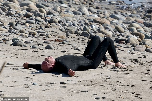 Dominic Purcell was spotted spending a day at the beach alone amid accusations that Tish Cyrus had 'stolen' him from her daughter Noah Cyrus.