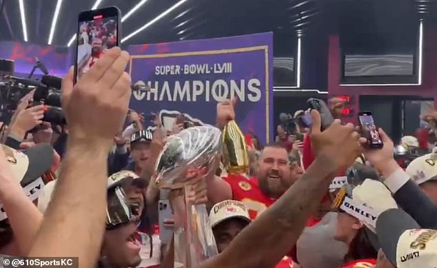 The Chiefs star was even seen drinking from what appeared to be a golden bottle of champagne.