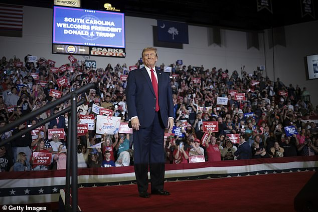 Former President Donald Trump arrives on stage during a Get Out The Vote rally at Coastal Carolina University on February 10, 2024 in Conway, South Carolina.
