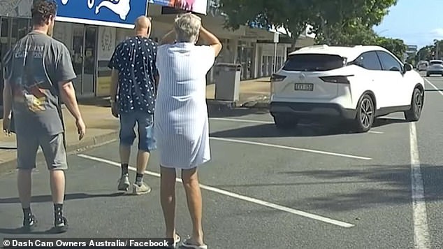 An elderly woman watched in disbelief as her car was allegedly stolen right in front of her (pictured) after a thief pretended to help her change a flat tyre.