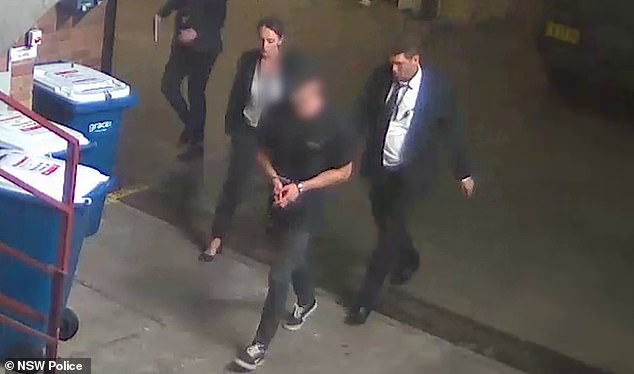 Beau Lamarre-Condon (pictured in handcuffs) handed himself in to police at Bondi police station at 10.39am on Friday.
