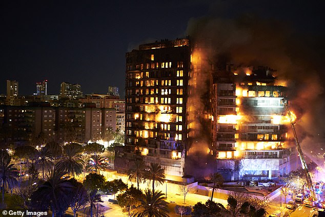 Firefighters expect to find 14 more bodies when they enter a Spanish apartment block destroyed by fire (pictured on Thursday night) in a disaster similar to Grenfell Tower.