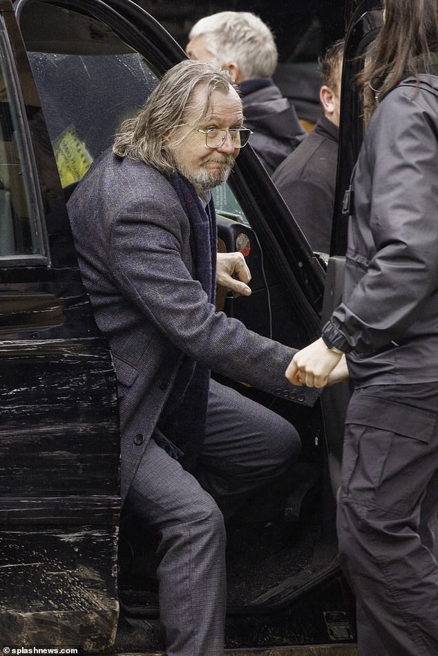 Gary Oldman's black taxi broke down while filming new series of Slow Horses in rainy London this week