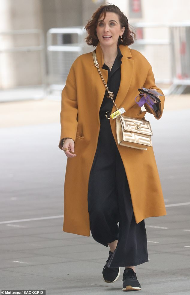 Vicky McClure, 40, looked chic in an orange coat and sparkly gold bag outside the BBC Radio 2 studios in London on Saturday.