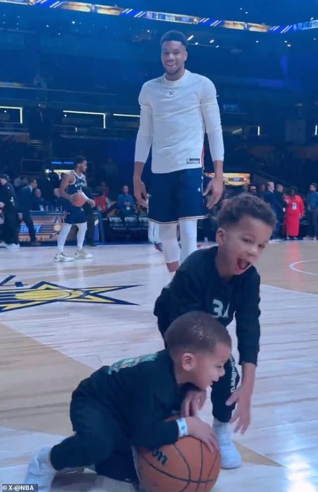 Giannis Antetokounmpo smiled as his children adorably fought for a ball on the court.
