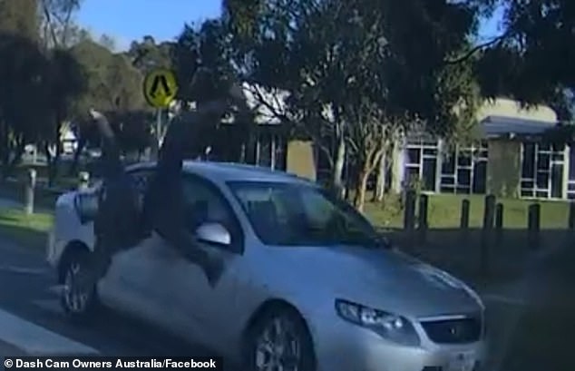 Shocking footage has emerged of the moment a sedan driver collided with a young electric scooter driver (pictured)