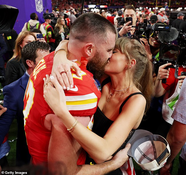 The Super Bowl win certainly went to Swift, whose blinding star power is such that she seems to obscure everyone around her, writes Sarah Vine.  She hugged her Chiefs star boyfriend, Travis Kelce, at the end of the game.