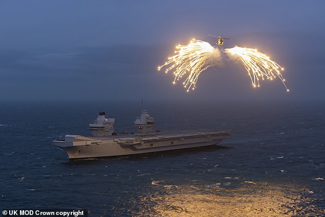 A Merlin helicopter from 820 Naval Air Squadron loaded and fired flares from HMS Prince of Wales, as it embarked for Exercise Steadfast Defender.
