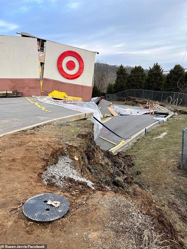 The hill collapsed and took the corner of the store with it.