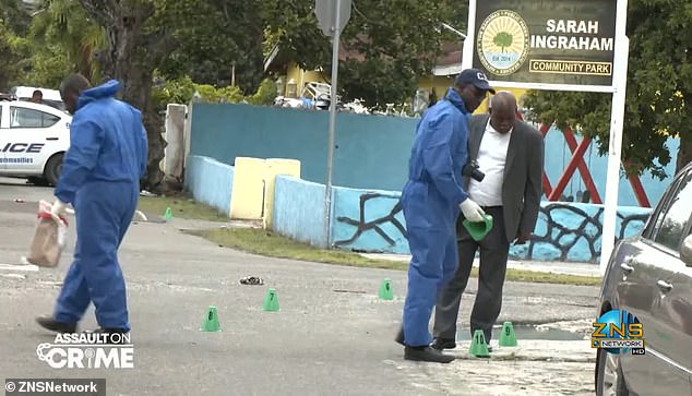 Investigators work at the scene of a recent homicide in the Bahamas. The archipelago of 400,000 people has recorded 25 murders this year, a sharp increase from historical norms.
