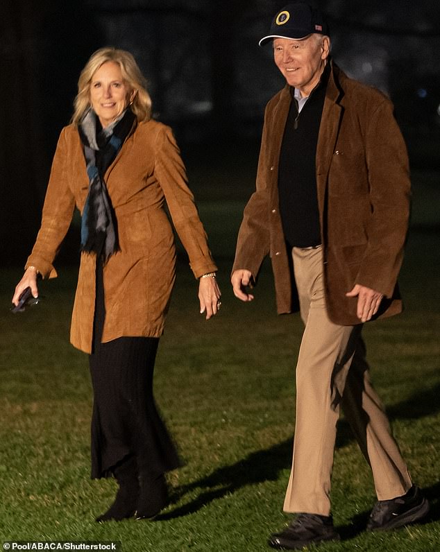 US President Joe Biden and First Lady Jill Biden walk on the South Lawn of the White House yesterday.