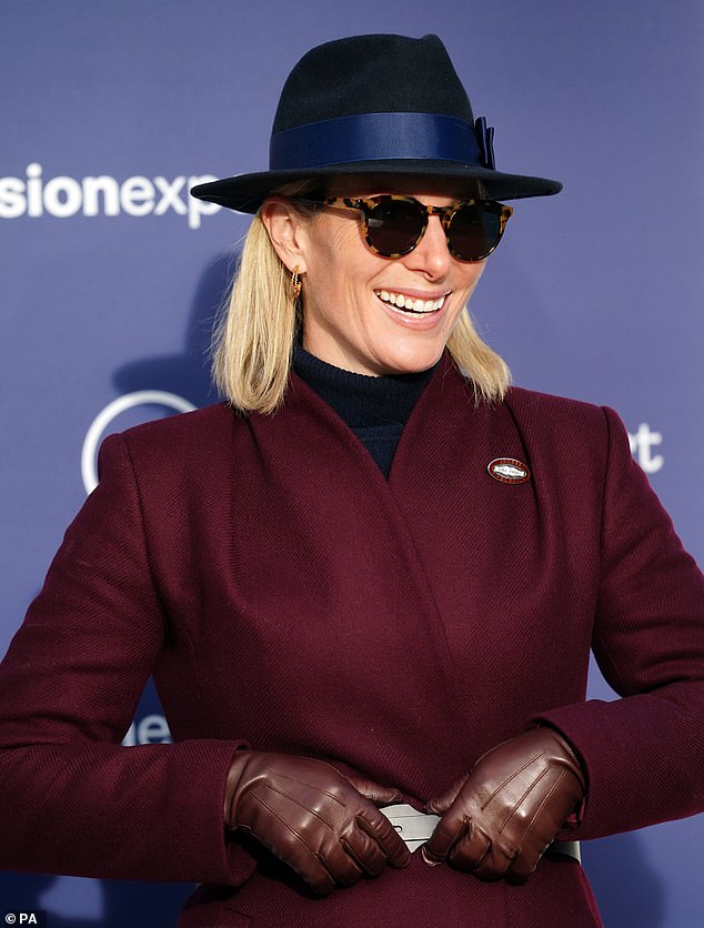 Last month, Zara showed off her chic fashion sense by opting for a complete burgundy ensemble while enjoying a day out alone at Cheltenham's Trials Day Festival.