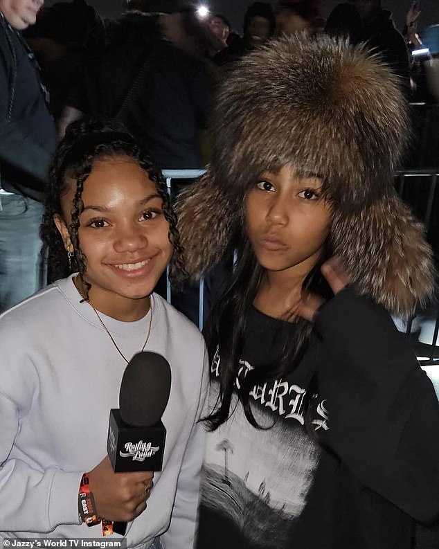 North West (right) gave her first on-camera interview about her debut album Elementary School Dropout with the 13-year-old reporter (left) behind Jazzy's World TV while at Rolling Loud California last Thursday.