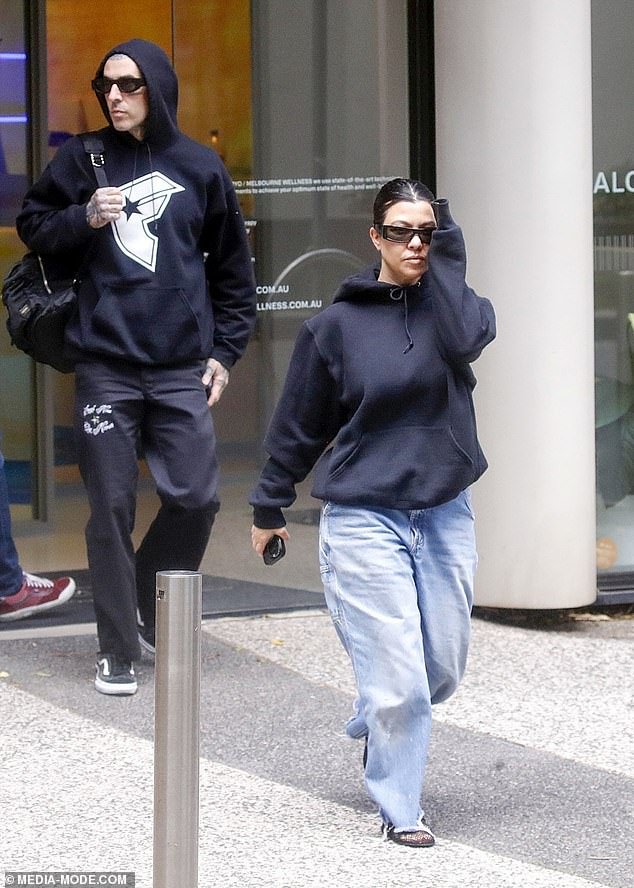Kourtney, 44, dressed casually for the outing in blue jeans, a black sweater and a pair of sandals.
