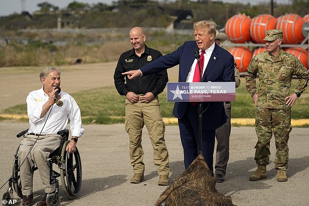 Republican presidential candidate former President Donald Trump points to Texas Gov. Greg Abbott as he speaks in Shelby Park during a visit to the U.S.-Mexico border, Thursday, Feb. 29, 2024, in Eagle Pass, Texas.