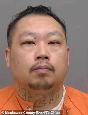 Baur's boyfriend, Jesse Vang, 39 (pictured), claimed he was asleep when Elijah disappeared and faces charges of child neglect as a party to a crime.