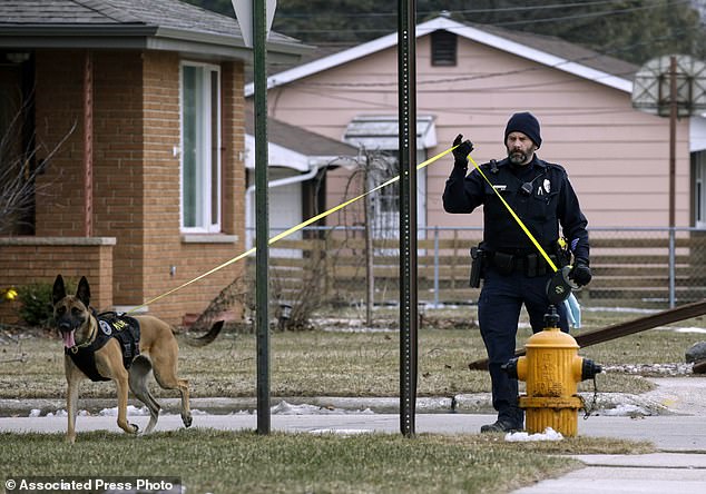 Manitowoc Police Officer Nick Place and a K-9 dog search for missing 3-year-old boy in Two Rivers, Wisconsin.