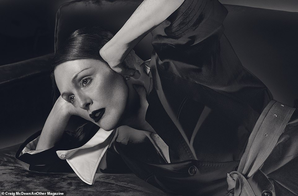 Julianne poses in Maison Margiela's collared and belted jacket