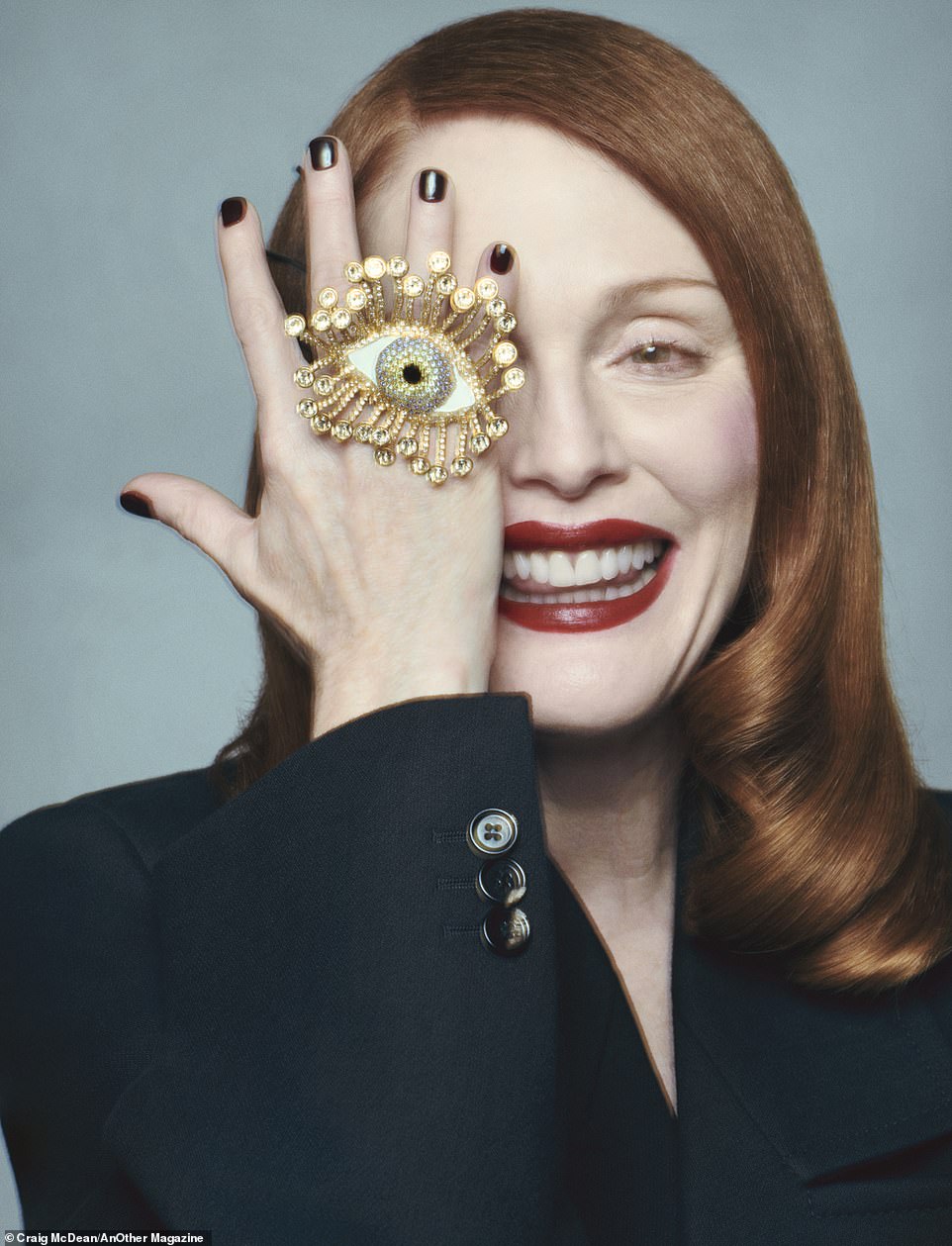 In a more whimsical photo, the star wears a Bottega Veneta jacket and a large Schiaparelli ring with an eye, which she playfully placed over her own eye.