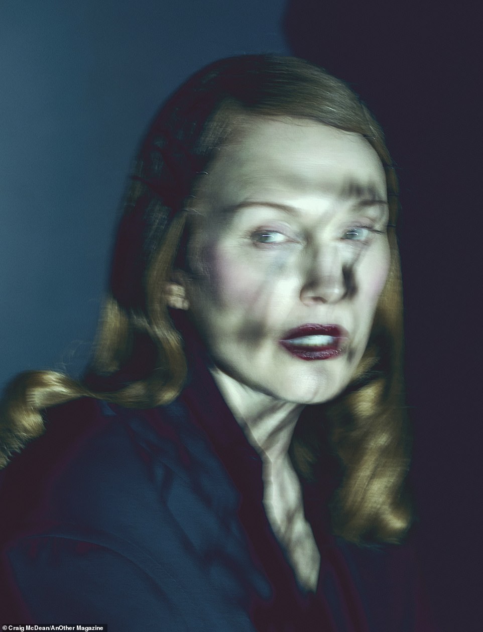And finally, one photo is a close profile of the beauty with shadows falling on her face. Her hair is styled in a Veronica Lake style and when she looks over her shoulder it is not clear if she was the hunted or the hunter.