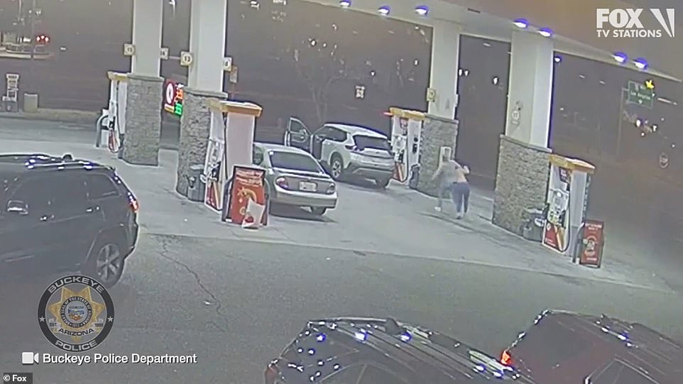 One arm is enough to drag the young woman back to the car she had just escaped from.