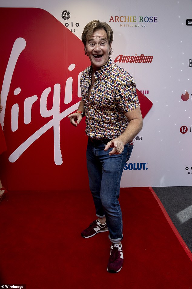 Entertainment reporter Richard Reid dressed to impress in a printed shirt and jeans.