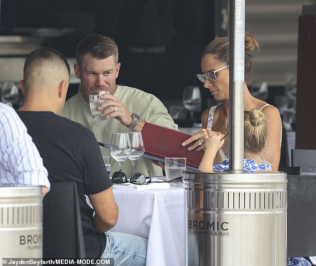 Candice and David are pictured enjoying lunch with their family.