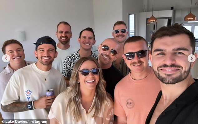 Luke Davies is pictured, front left, with friends at his farewell party in Brisbane.