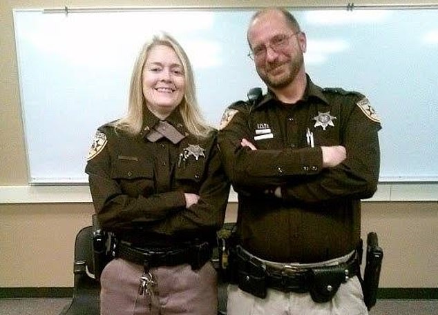 Jenn with a colleague at the Campbell County Sheriff's Department, where she has spent her career as a detention officer.