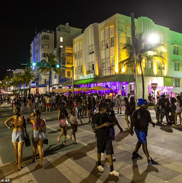 Law enforcement authorities also vowed to crack down on the wild party season, as Miami Beach Police Chief Wayne Jones assured the public during a spring break news conference on February 15. Pictured: Crowds in Miami Beach after the two fatal shootings.