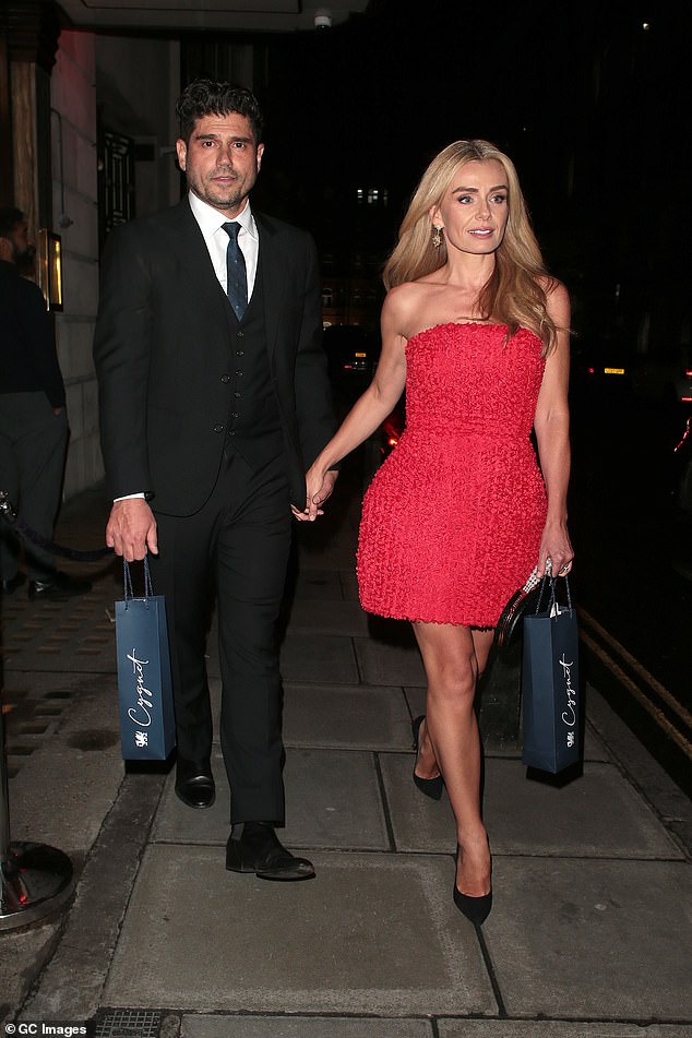 The Welsh singer looked as stylish as ever in a strapless pink mini dress with a structured skirt as she left Langan's Brasserie in Mayfair, London.