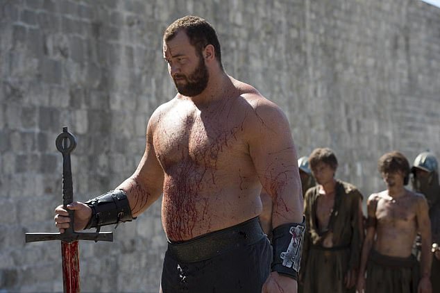 Hafthor Bjornsson appears pictured above in Game of Thrones, where he played 'The Mountain' who was said to be so strong he could cut a man in two.