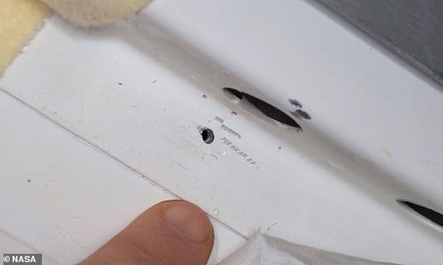 In August 2018, astronauts rushed to fix a hole (pictured) that had appeared in the outer wall of the Soyuz capsule at the orbital laboratory.