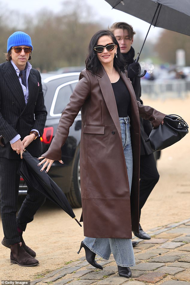 Eva Green, 43, looked sophisticated in a long brown jacket which she paired with jeans and black heeled boots.