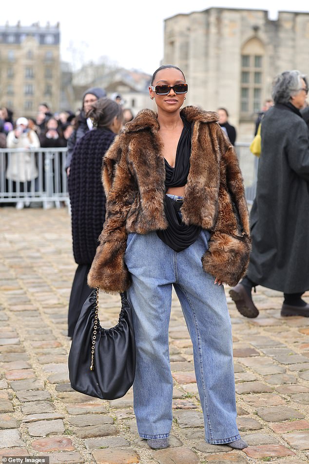 Sophie Wilde wowed in a fur coat and showed off plenty of skin as she paired the coat with a black cropped top.