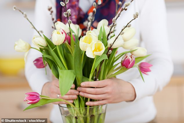 Changing the water in your vase is also key to making your blooming bouquet last longer, so you eliminate potential bacteria (stock image)