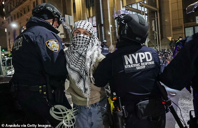 1709304376 14 Pro Palestinian protesters ride the famous Wall Street Bull and dare