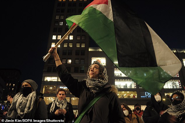 1709304377 224 Pro Palestinian protesters ride the famous Wall Street Bull and dare
