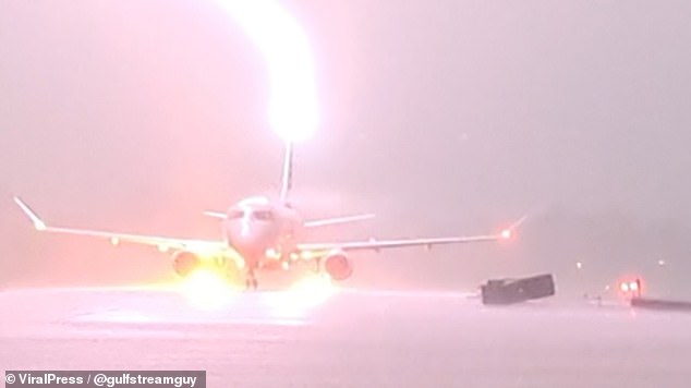 Insurance agencies shell out about $1 billion a year for lightning damage claims (above, lightning strikes an American Eagle plane full of passengers in Arkansas)