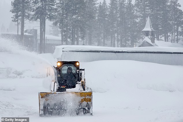 The NWS said Thursday that strong winds had already caused damage around the Lake Tahoe area, and that even stronger winds with gusts up to 80 mph were expected today (pictured in Kingvale, California on Thursday).