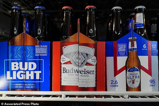 Six-packs of Bud Light, Budweiser and Michelob Ultra are displayed at a liquor store, on February 28, 2024, in Fairfield, California.