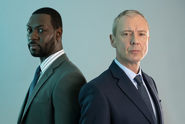 ITV confirmed to the Sun that Detective Superintendent Roy Grace, played by John Simm, will return for a fifth series (pictured with Richie Campbell as DS Branson (left)