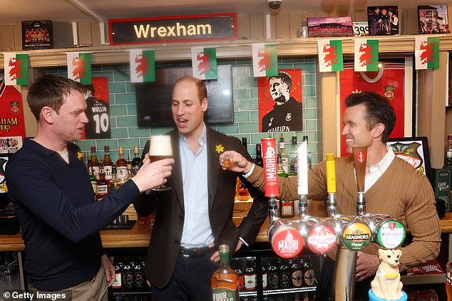 Prince William checks out the pint he had today in the Wrexham pub.