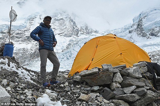 Nepalese climber Kami Rita Sherpa poses during an interview with AFP at Everest Base Camp on Mount Everest in 2021.