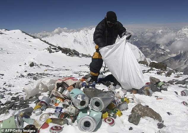 Garbage collected from the mountain, as shown here in a 2010 cleanup near 8,000m, is taken down the mountain where it is recycled or dumped in landfills.