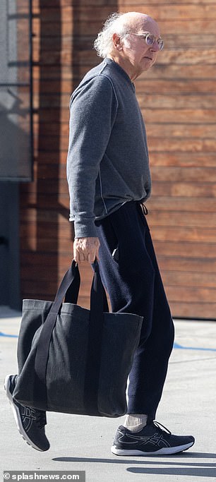 David looked relaxed in black joggers, a gray sweatshirt and sneakers.